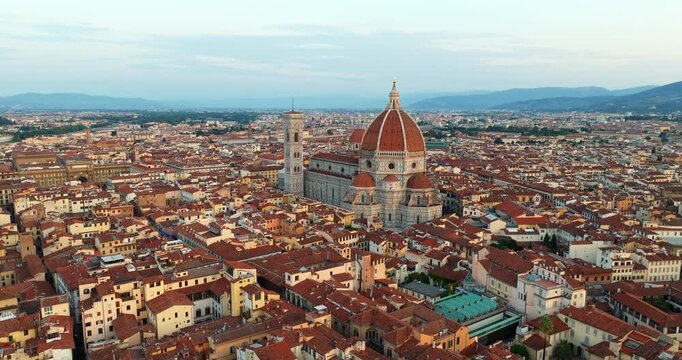 Florence aerial daytime wide panorama Duomo cathedral terracotta rooftops baptistery Tuscany Italy Renaissance cityscape travel landmark drone slow motion Firenze historic overview tourism summer
