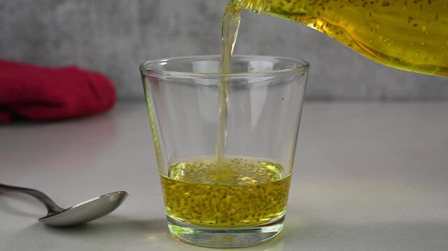 Serving nannari sharbat in a glass cup.