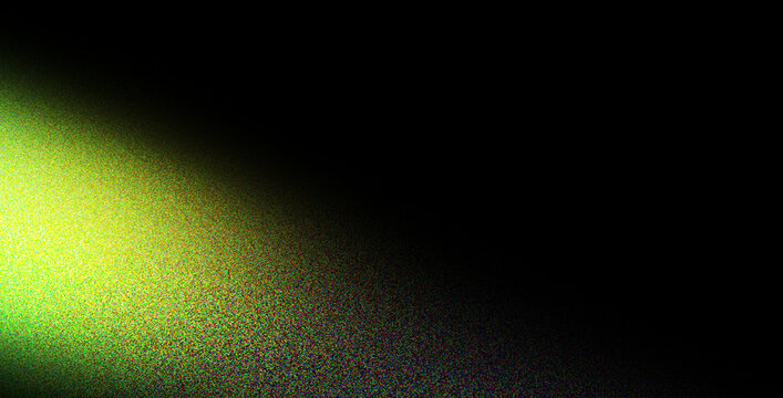 Bright green laser light beam shining through dark abstract background with bokeh effect