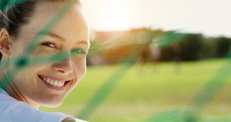 Happy, net and woman on soccer field for fitness, training and positive attitude for match. Portrait, female person and outdoor with flare for football, exercise and practice sports for competition © peopleimages.com