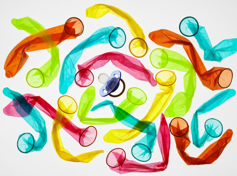 Birth control, Condoms encircling a babies soother