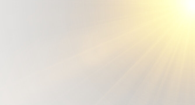 Golden sun rays and soft lens flare from the right corner on a light grey background