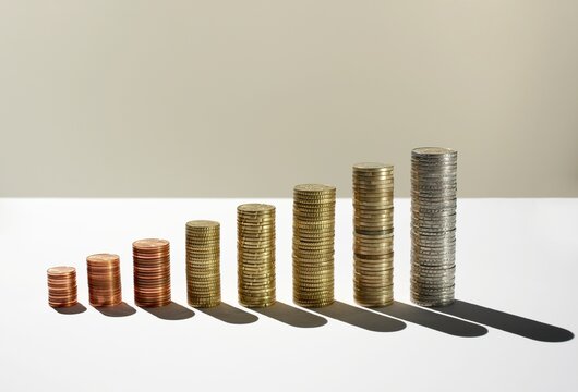 Ascending stacks of Euro cent coins forming a bar chart