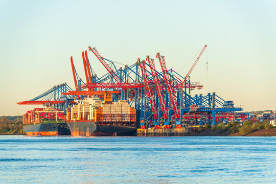 Industrial container ship at Hamburg harbor logistics hub
