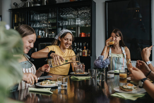 Group of teenage girls meeting for homemade brunch
