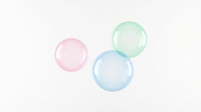 Three colorful translucent bubbles floating against a clean white background