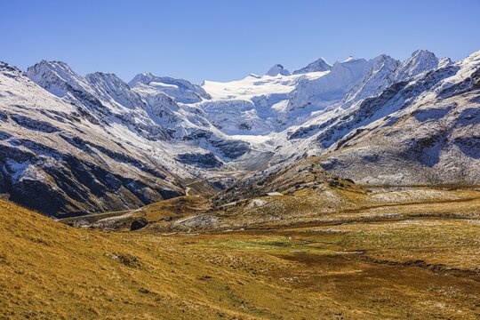Alpine meadows covered in light snow, with the Moiry glacier in the background, near Grimentz, Val d'Anniviers, Valais Alps, Canton Valais, Switzerland