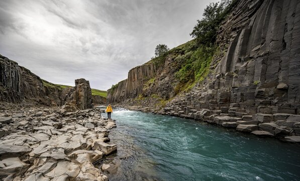 Tourist at Stu&eth;lagil Canyon, basalt columns, Egilsstadir, Iceland