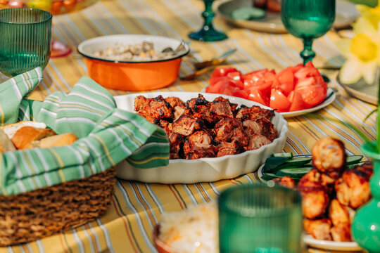 Spring Easter table with traditional food and fried meat outdoors