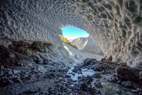 Germany, Bavaria, Berchtesgaden, Cave in Eiskapelle snowfield