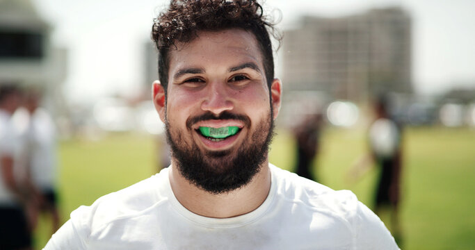 Portrait, rugby and man with mouthguard for sports, game training and gum safety at field. Happy, player and person outdoor with teeth protection, professional athlete and exercise for fitness