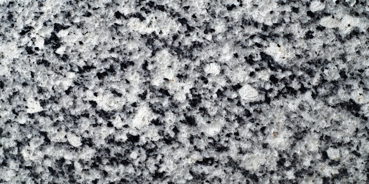 Black and white speckled granite polished surface with sharp detail and high fidelity texture
