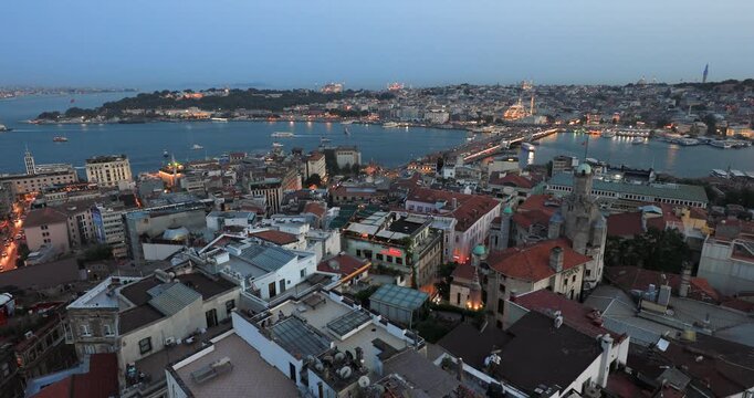 4K locked down stationery  motion view of the city skyline of Istanbul, the Galata Bridge and Bosporus inlet on dusk, Istanbul, Turkey, Eastern Europe