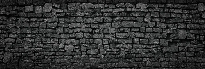 Fototapete Steinwand black stone wall an old castle, dark background of slate bricks  © dmitr1ch