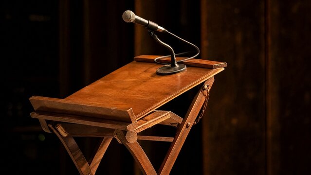 lectern. A vintage wooden folding lectern with a microphone on top, warm stage light, textured wood. event programs, museum guides, designed for cultural heritage projects and event programs.