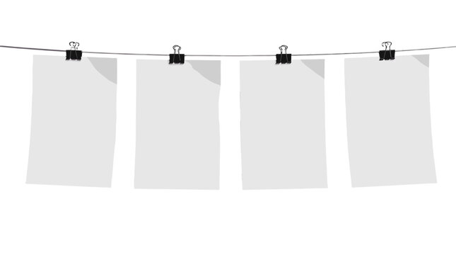 Four blank white posters hanging on a line with binder clips