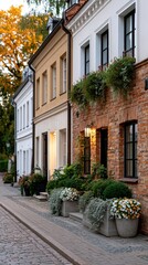 Obraz premium Narrow historic street with flowering planters and church tower view, urban romance, cultural heritage, travel destination, charming city life.