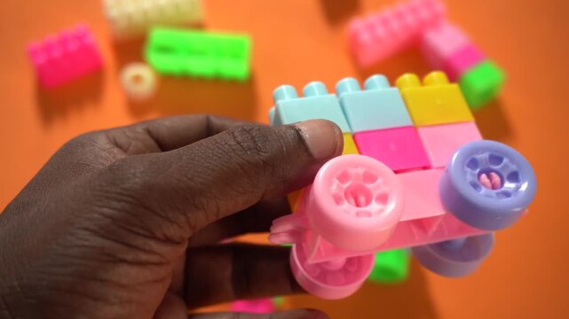 Colorful interlocking plastic building blocks for educational play, creativity development, problem-solving skills, and imaginative learning activities.