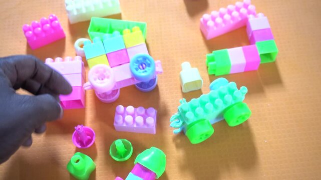Colorful interlocking plastic building blocks for educational play, creativity development, problem-solving skills, and imaginative learning activities.