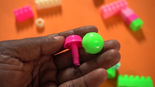 Colorful interlocking plastic building blocks for educational play, creativity development, problem-solving skills, and imaginative learning activities.