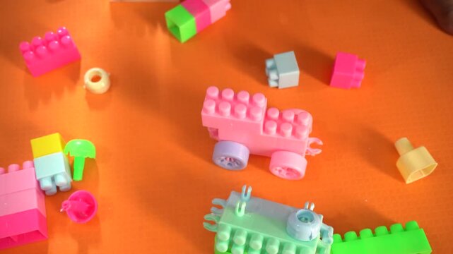 Colorful interlocking plastic building blocks for educational play, creativity development, problem-solving skills, and imaginative learning activities.