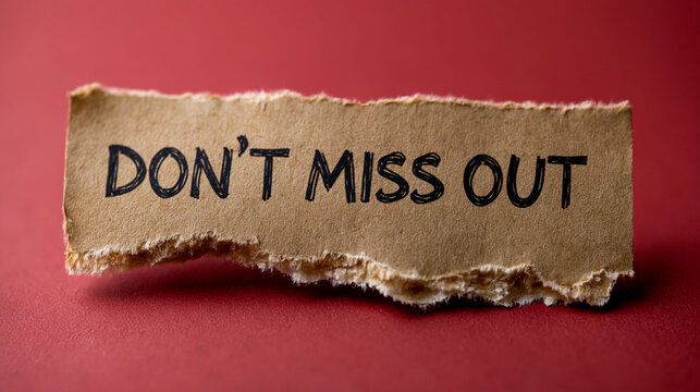 Don't Miss Out Message: A torn piece of brown paper with the handwritten phrase DON'T MISS OUT on a red background, urging action and highlighting urgency.