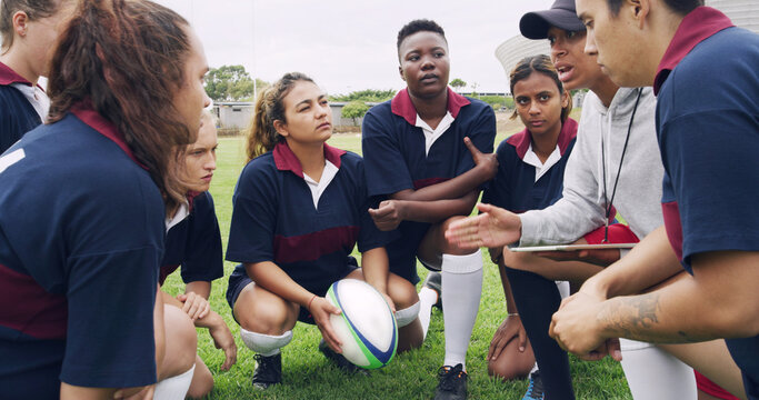 Tablet, advice and sports with women on rugby field for teamwork, game plan and discussion together. Strategy, defense formation and training tips with people in stadium for coaching and fitness