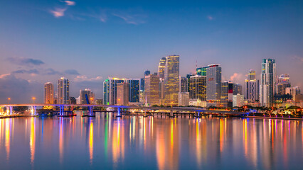 Obraz premium Miami, Florida, USA. Aerial cityscape image of Miami, Florida with reflection of the city skyline in the water at beautiful sunrise.