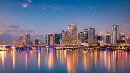 Miami, Florida, USA. Aerial cityscape image of Miami, Florida with reflection of the city skyline in the water at beautiful sunrise. © rudi1976