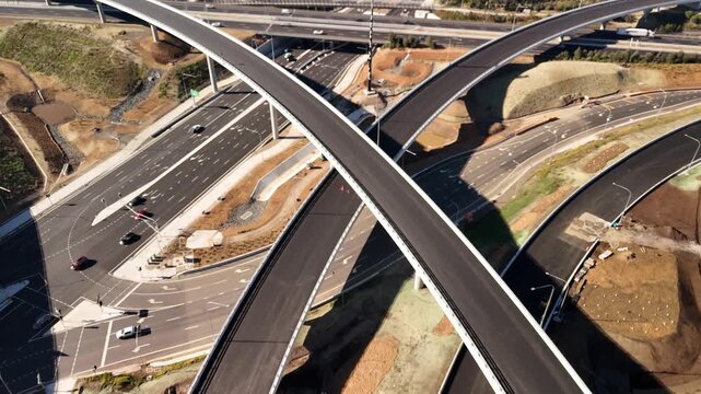 Aerial drone reverse view above the M7 -M12 Interchange at Cecil Hills, Western Sydney, NSW Australia on a sunny morning in June 2026