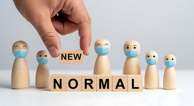 Wooden peg people with face masks and wooden blocks spelling new normal in a conceptual arrangement figurine doll