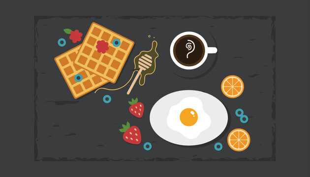 Delicious breakfast tray seen from above with waffles, honey, a fried egg, fruit, and a cup of black coffee on dark stone.