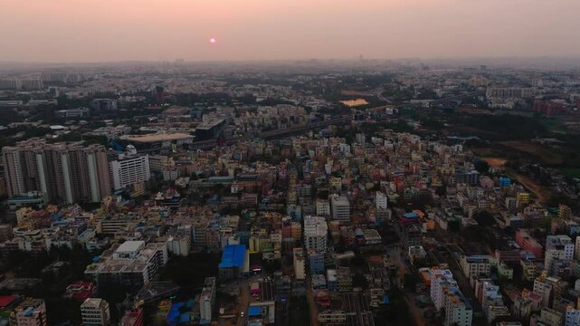 Aerial view of Silicon town with electronic city, residential buildings, apartments, corporate building and sun at Bangalore, karnataka, india. day time, push in shot, drone shot, 4k.