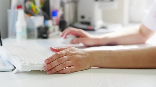 Doctor records patient medical history on computer