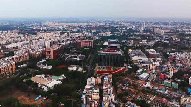 glass faded buildings with road, apartments, residential buildings and sky at electronic city, Bengaluru, karnataka, india. day time, push back shot, drone shot, 4k.