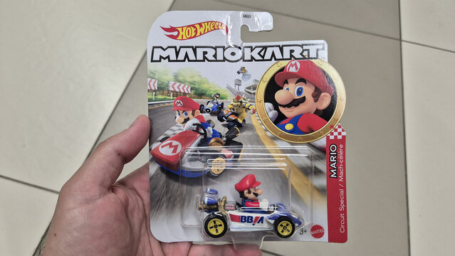 A packaged Hot Wheels Mario Kart die-cast toy car held in a person's hand. Picture taken on June 8, 2026 in Bucharest, Romania.