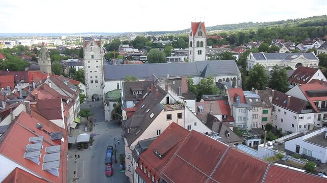 RAVENSBURG, GERMANY - JULY 10, 2025: Static aerial view of Ravensburg old town looking towards Weingarten with Frauentor tower and Liebfrauenkirche church, Germany