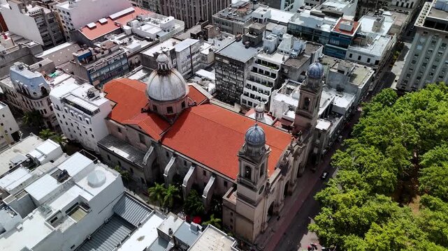 Aerial drone view circling Montevideo Metropolitan Cathedral, Plaza de la Constituci&oacute;n, Uruguay