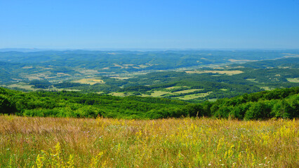 Fototapeta premium The hills and valleys of Mures County, Transylvania, in early summer.