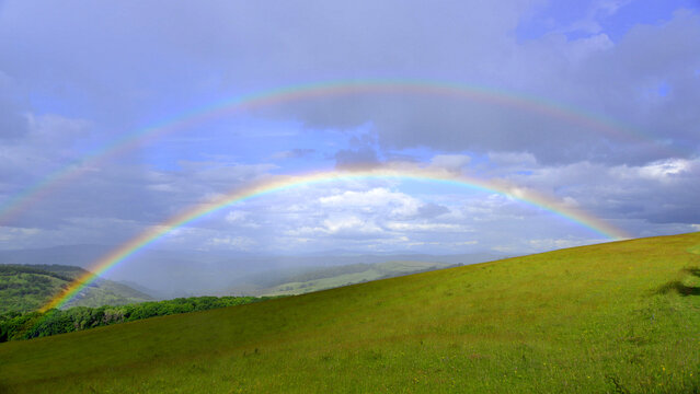 A double rainbow after the rain in the hills of Mures County, Transylvania.