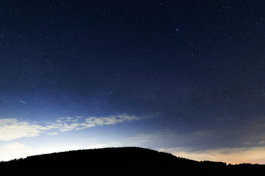 Constellations, landscape, Milky Way stars on a dark countryside skies.