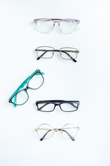 Glasses for vision on a white background in optical store. Vision test concept, stylish glasses...