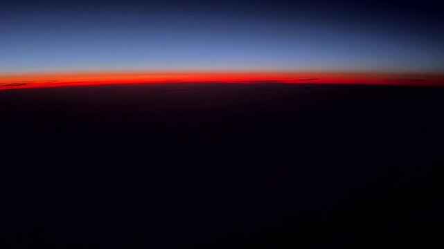 A time lapse of a North Atlantic sun rise seen by pilots of a jet aircraft.