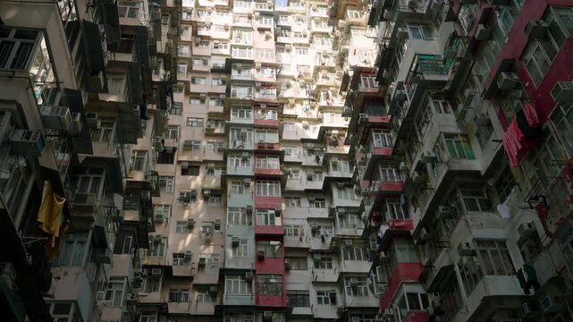 Complex Of Five Interconnected Apartment Blocks - Monster Building In Quarry Bay, Hong Kong. Low Angle Rotate Shot
