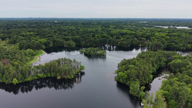 Aerial view of Harold Parker State Forest in Andover, Massachusetts, with the Boston skyline visible on the distant horizon, USA