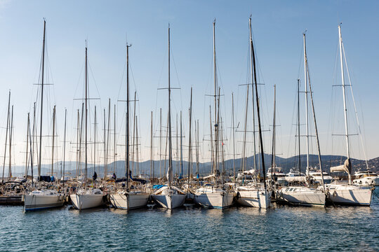 Sailboats and luxury yachts moored in St Tropez harbor, France