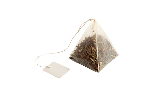Pyramid shaped mesh tea bag with dry herbal tea inside isolated on transparent background Png cut out