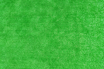 Obraz premium Green lawn, emerald grass, green artificial grass, various shades of green, natural backdrop for eco-friendly design projects