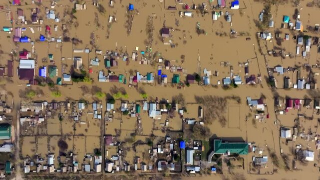 Aerial view of homes submerged by devastating floods.
