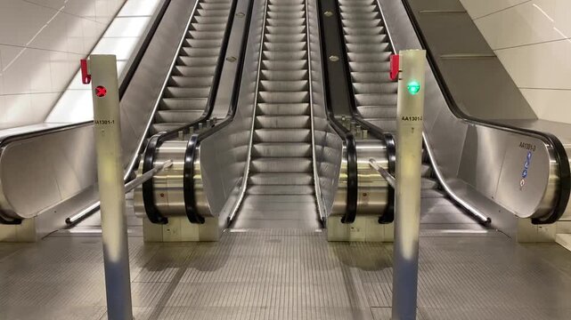 modern escalators in contemporary shopping mall or metro station interior